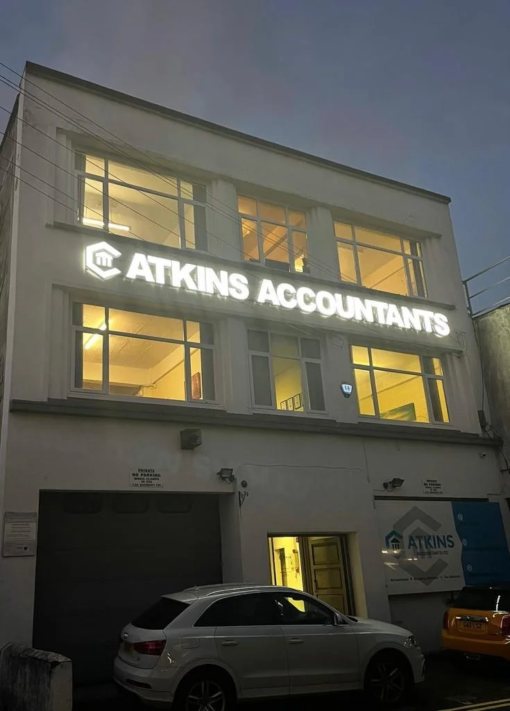 Atkins Accountants Swansea premises illuminated in the evening